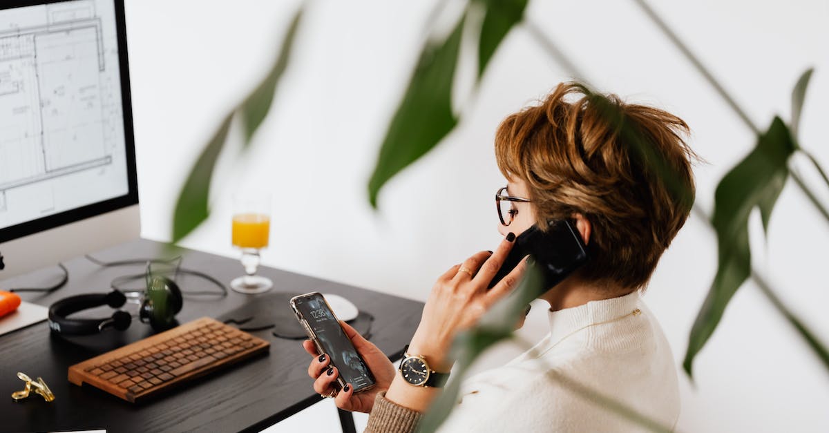 How do the sets work that call additional followers to your side? - Busy female talking on smartphone and checking messages during work in contemporary office