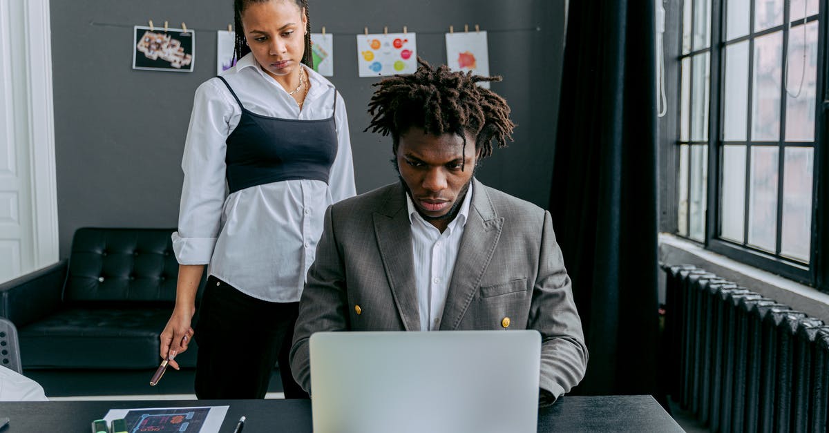 How do the Stands work? - Man in Black Suit Jacket Using Macbook