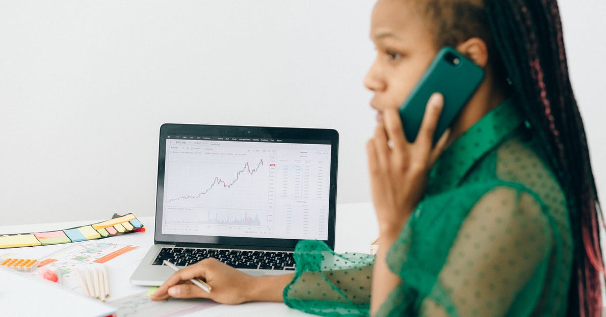 How do Trade Winds work? - Man in Green and Black Sweater Holding Iphone