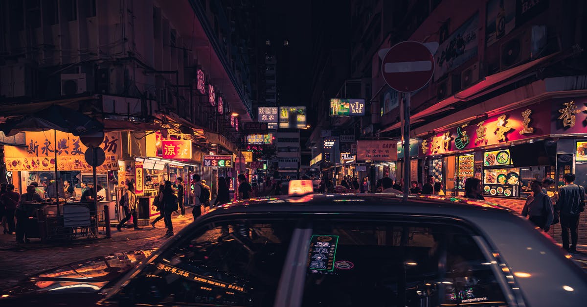 How do travelers work? - Photo of Taxi Near Buildings During Nighttime How do travelers work? - Photo of Taxi Near Buildings During Nighttime
