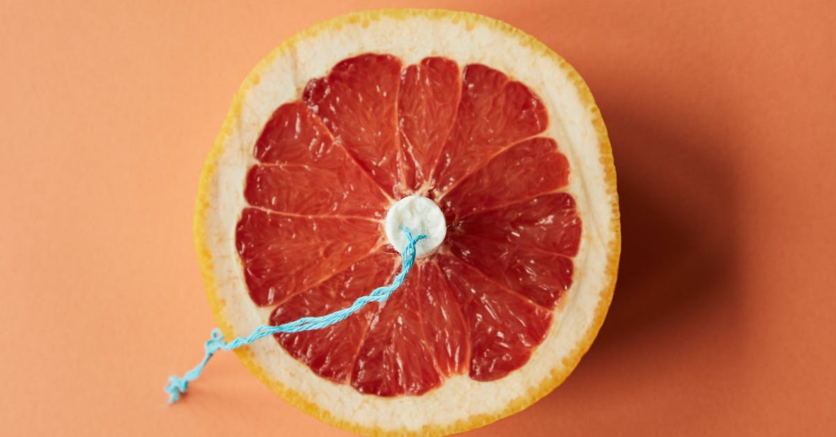 how do use the ~ symbol with cloning? - Sliced grapefruit with tampon as symbol of menstruation how do use the ~ symbol with cloning? - Sliced grapefruit with tampon as symbol of menstruation