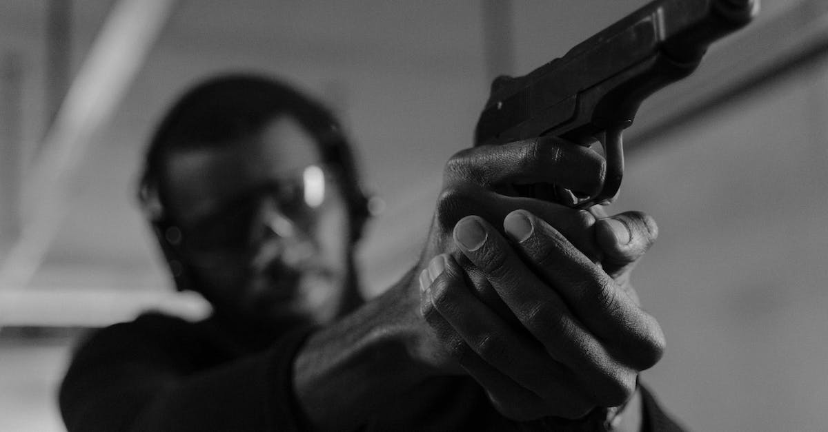 How do you aim with a pistol during combat? - A Man Aiming a Pistol in Target Practice How do you aim with a pistol during combat? - A Man Aiming a Pistol in Target Practice