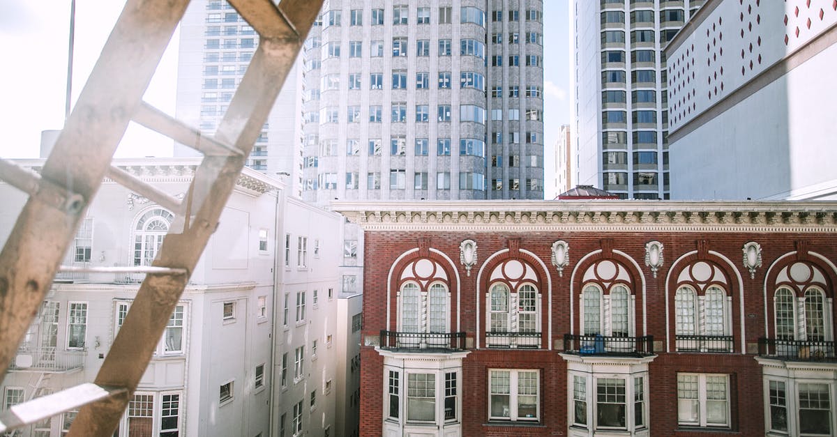 How do you break the one tile high speed booster block in Ferenia? - Facades of residential houses with small balconies and decorated windows located in modern city