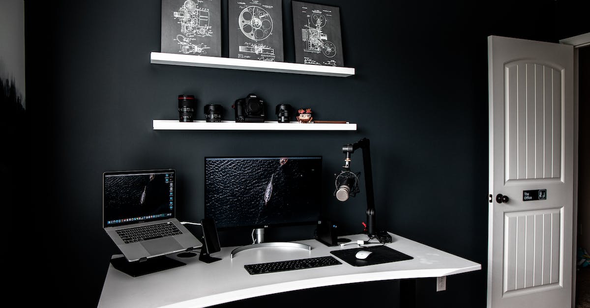 How do you change your color scheme in Skullgirls? - Modern style workspace with laptop near monitor and professional microphone on white table under shelves with schemes in frames