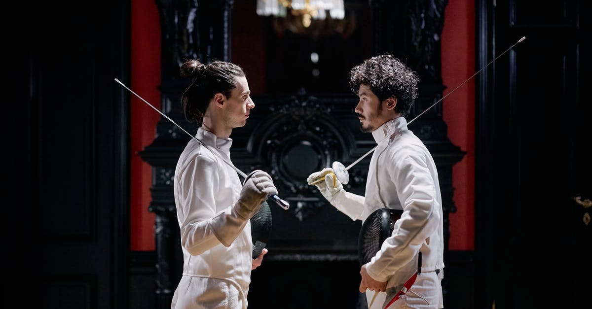 How do you deploy Battle Gear? - Men Fencers Looking at each other while Holding their Fencing Foils How do you deploy Battle Gear? - Men Fencers Looking at each other while Holding their Fencing Foils
