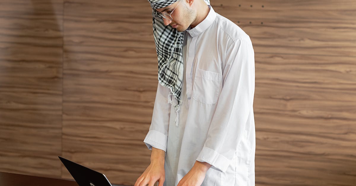 How do you disappear using Lucario in SSBB? - Man in White Thobe Using Black Laptop Computer