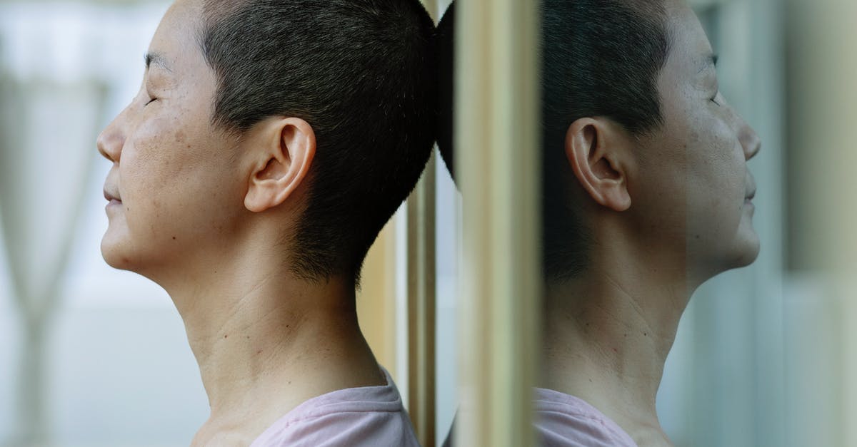 How do you effectively fight when armatized with a wind seraph? - Side view of ethnic ill female with short dark hair leaning on mirror at home