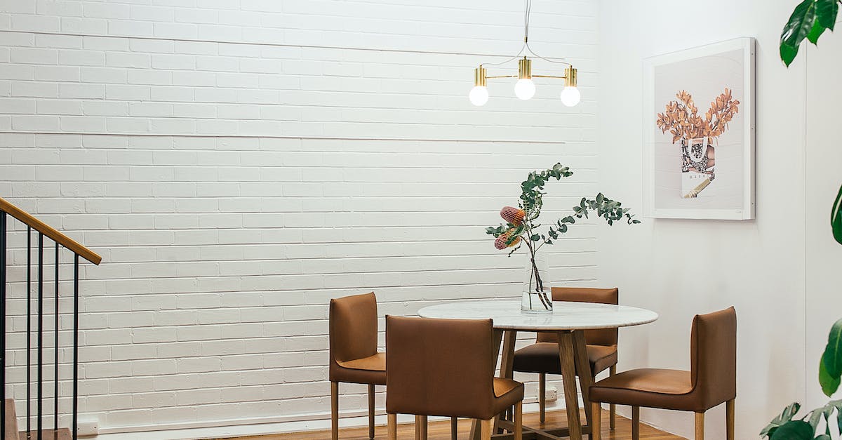 How do you get last 3 residential floors? - Table with vase near chairs and painting