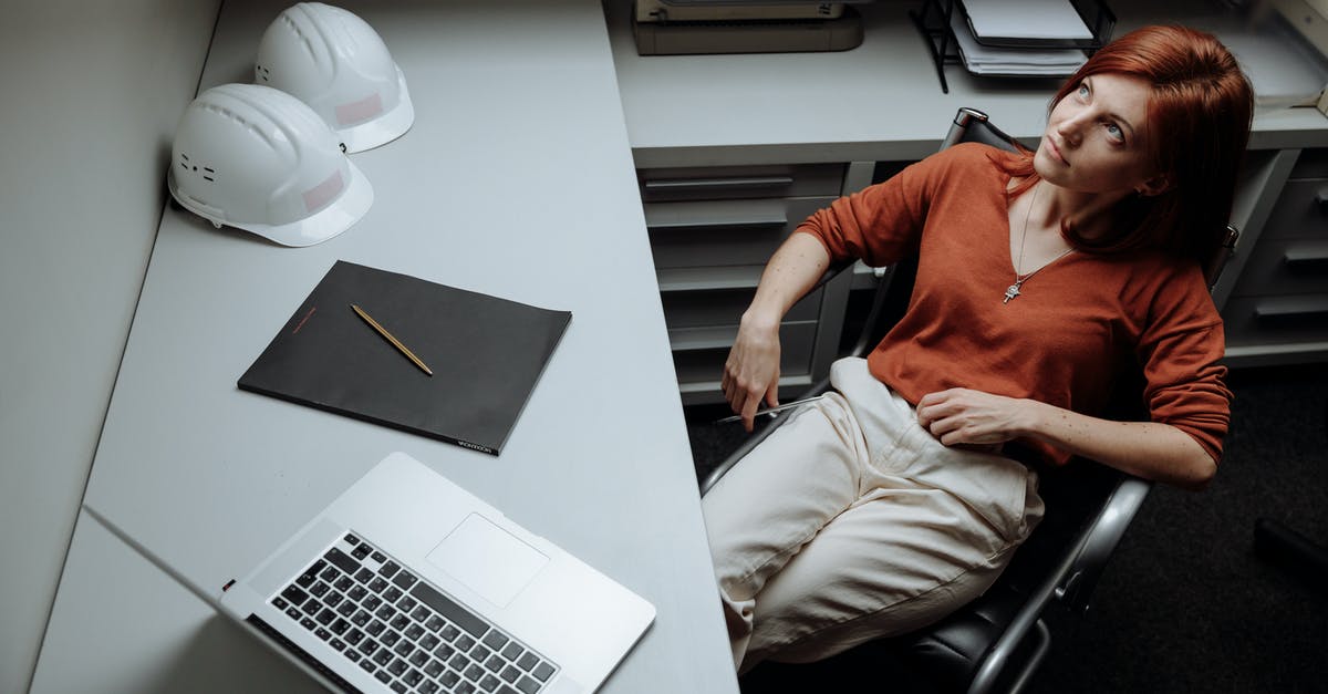 How do you get soldiers in Prison Architect without losing or mods? - Man in Orange Polo Shirt and Beige Pants Sitting on Black Office Rolling Chair