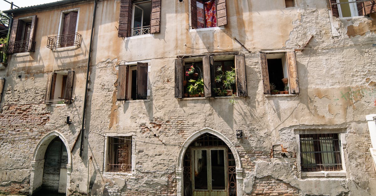 How do you get the Bone Charm in Mission 7, 'The Flooded District'? - Brown Concrete Building Beside River How do you get the Bone Charm in Mission 7, 'The Flooded District'? - Brown Concrete Building Beside River