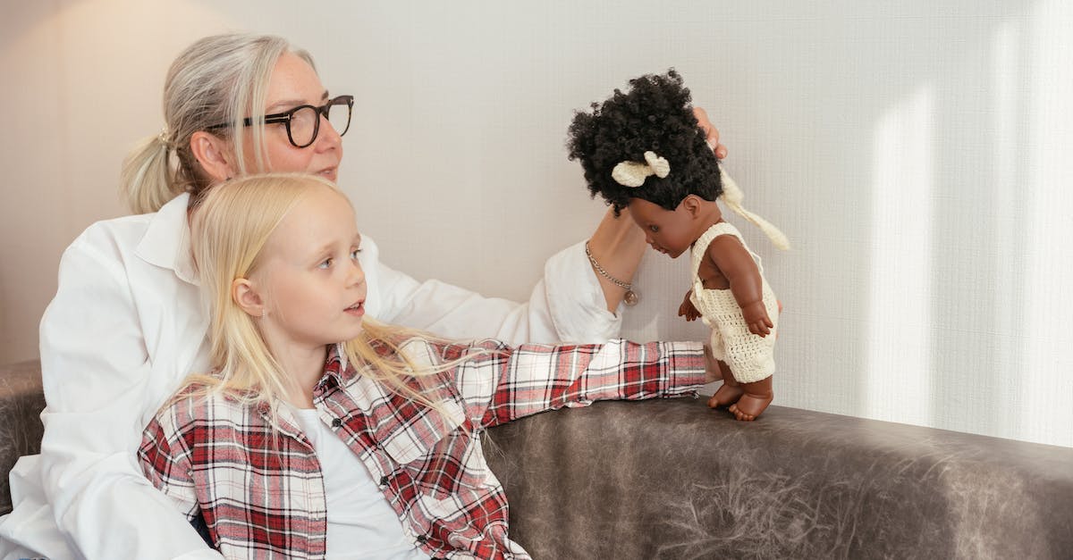 How do you get the toy hammer? - Woman in White Red and Blue Plaid Dress Shirt Sitting on Black Sofa
