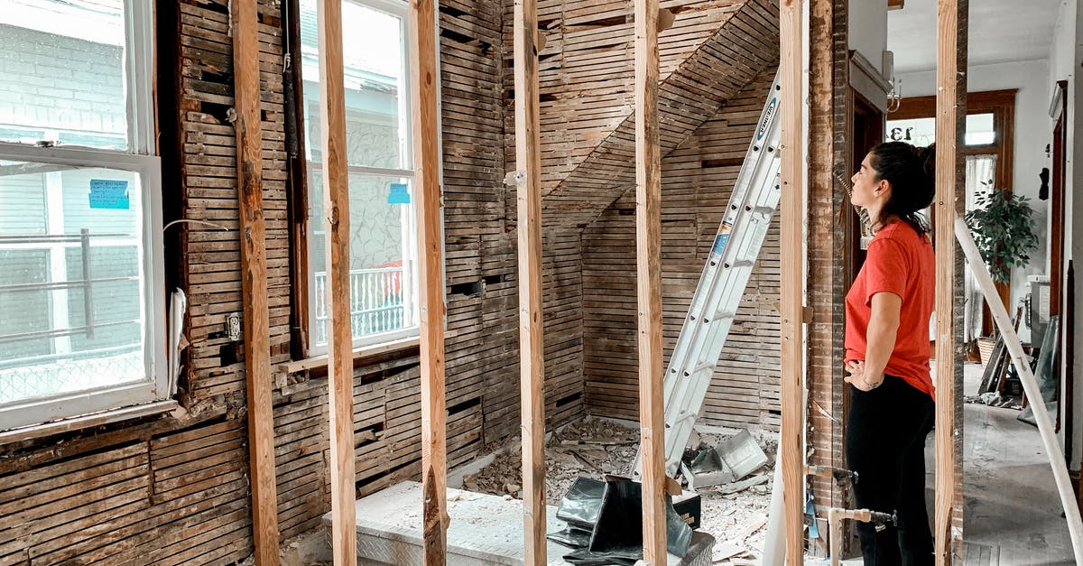 How do you get to build new RZs? - Woman standing in room with unfinished walls How do you get to build new RZs? - Woman standing in room with unfinished walls