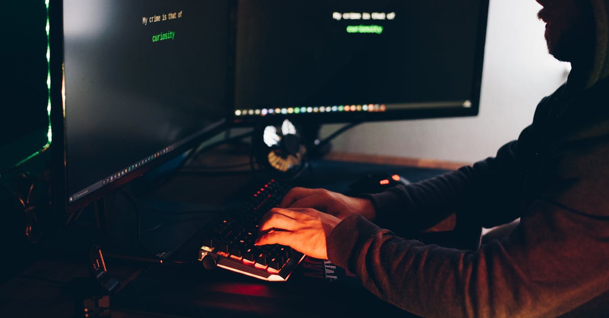 How do you hack Spectres? - Crop hacker silhouette typing on computer keyboard while hacking system