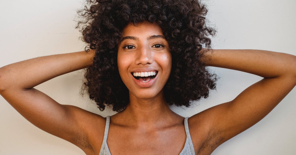 How do you headshot a Bastion in Sentry or Tank configuration? - Delighted black woman touching hair and looking at camera How do you headshot a Bastion in Sentry or Tank configuration? - Delighted black woman touching hair and looking at camera