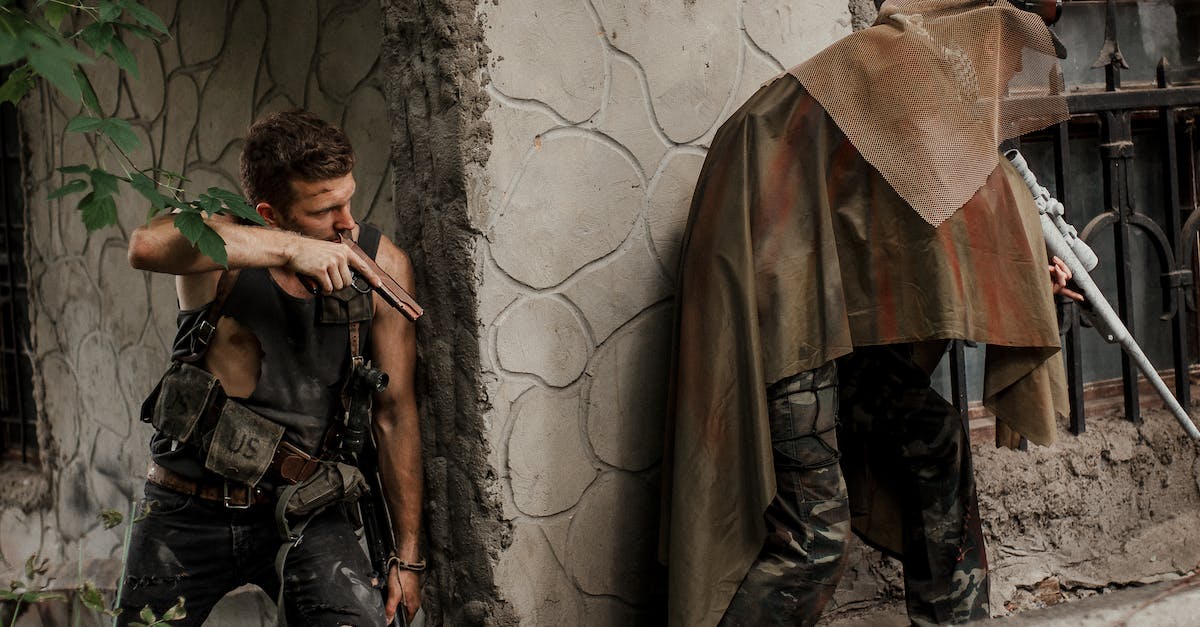 How do you improve weapons or armor? - Military Men Holding Guns Beside Concrete Corner