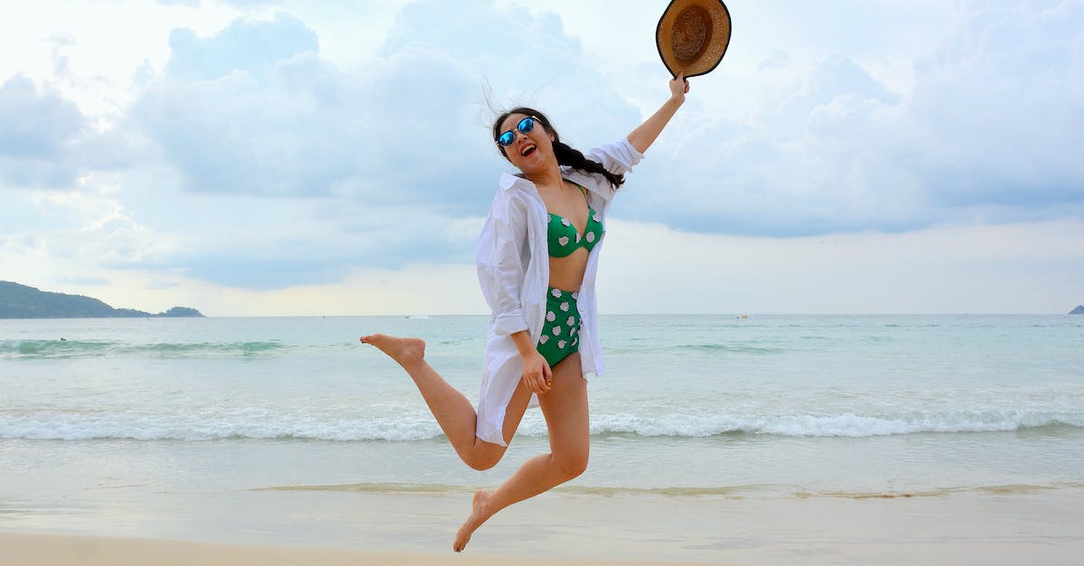 How do you jump across the water in level 1? - Woman Jumping on Seashore and Holding Hat How do you jump across the water in level 1? - Woman Jumping on Seashore and Holding Hat