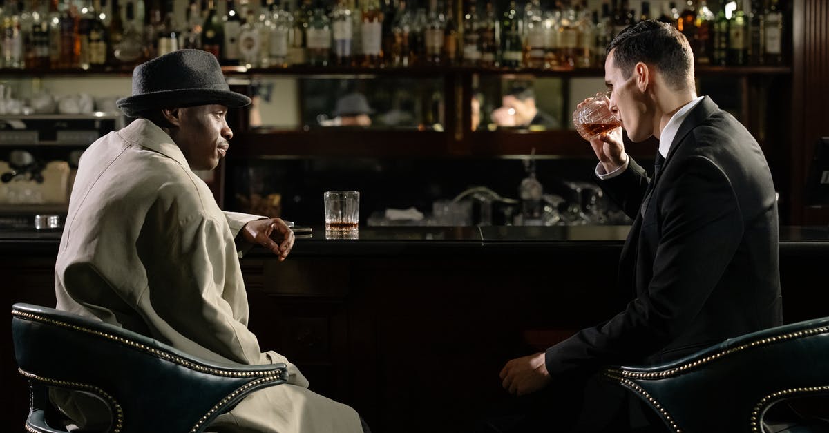How do you jump the gap in Threat Level Apricot? - Photo of Men Sitting in Front of Bar Counter