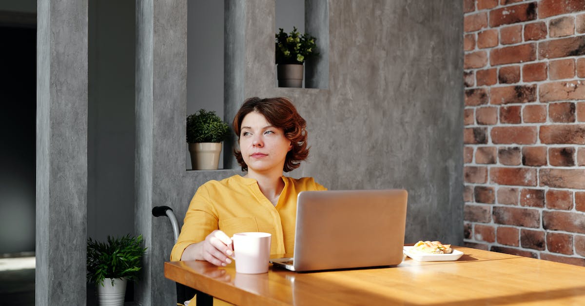 How do you keep the mobs away from your house at night? - Photo of Woman Sitting by the Table While Looking Away