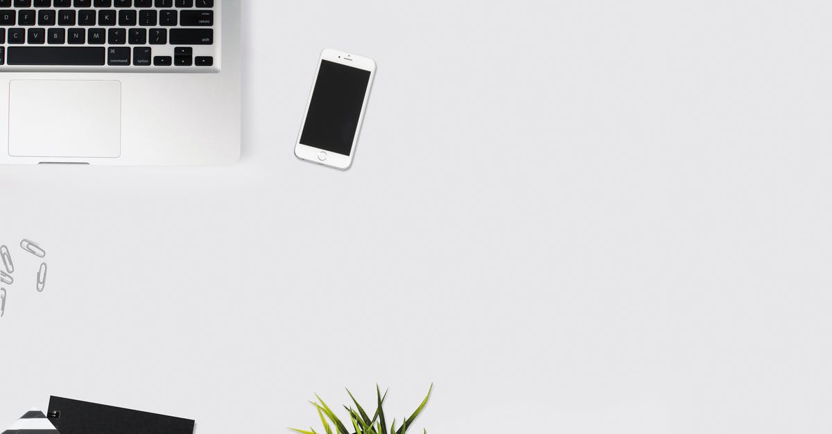 How do you minimize Age of Empires 3 on mac? - White Smartphone Beside Silver Laptop Computer How do you minimize Age of Empires 3 on mac? - White Smartphone Beside Silver Laptop Computer