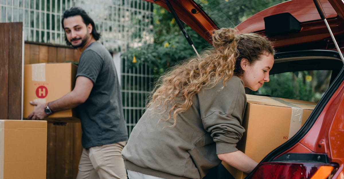 How do you move Quiet to a different position - Positive multiethnic boyfriend and girlfriend unloading car trunk during moving to new home in quiet green yard on summer day How do you move Quiet to a different position - Positive multiethnic boyfriend and girlfriend unloading car trunk during moving to new home in quiet green yard on summer day