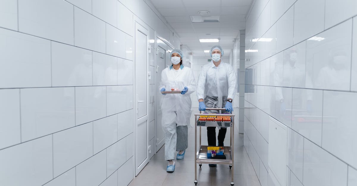 How do you not smash the laboratory wall? [duplicate] - People Walking at the Hallway while Carrying Medical Supplies