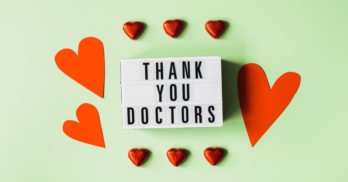 How do you prevent admins/ops on vanilla minecraft server to change gamemodes? - Top view of red heart shaped decorative elements and white retro light box with THANK YOU DOCTORS gratitude message arranged on green background