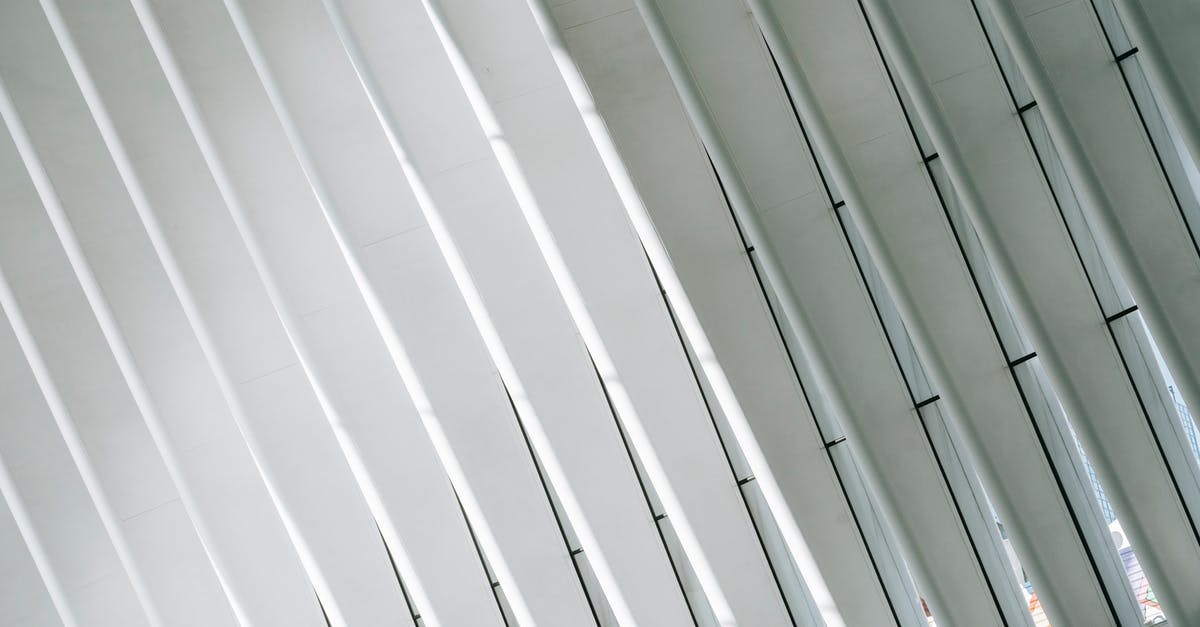 How do you remove a station from a line? - Low angle of geometric white walls with ribs and glass windows in modern minimalist building of terminal in New York