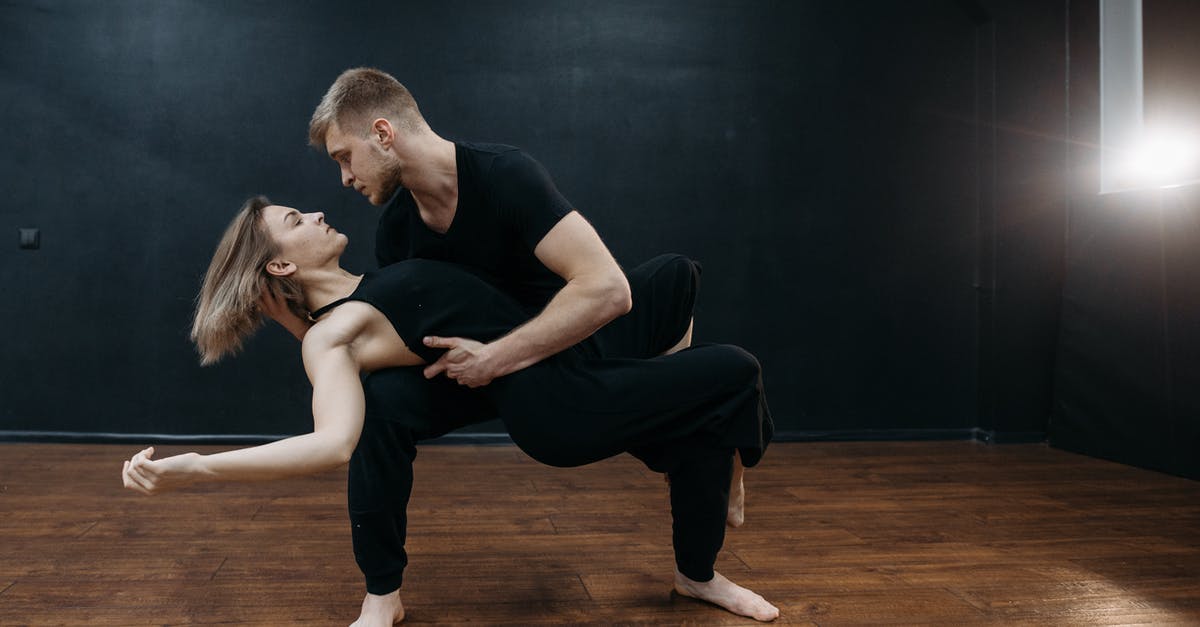 How do you unlock each of the Arms Manufacturers? - A Man Carrying a Woman in Black Tank Top while Looking at Each Other