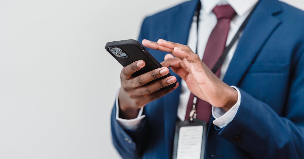 How do you unlock Imperial, Chiss, Kashyyyk, and Endor levels using salvage droids? - Man in Blue Suit Holding Black Smartphone