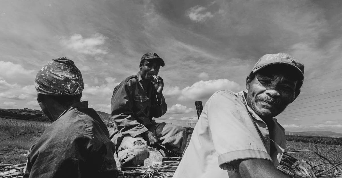 How do you unlock level caps of Palicos and Prowlers? - Grayscale Photo of 2 Men in White Robe