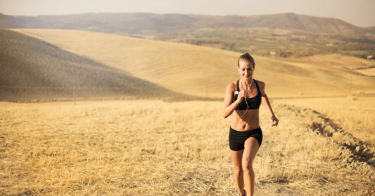 How do you unlock the speed run mode? - Happy young woman running in field