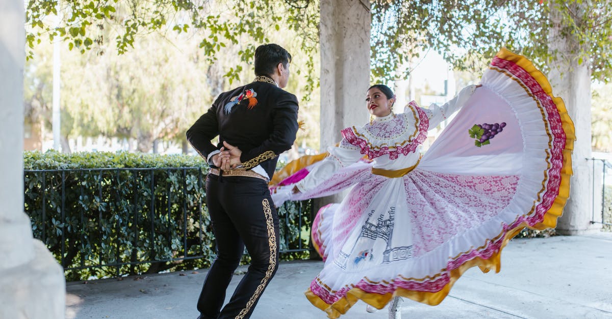 How do you unlock/find costumes in Marvel: Ultimate Alliance 2 - Man in Black Jacket and Woman in Pink and White Dress Walking on Sidewalk