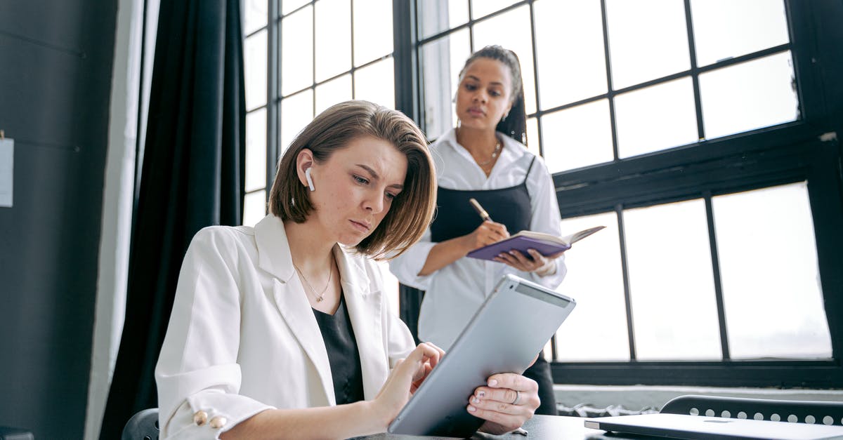 How do you use the team logo taunt? - Women Working in an Office and Using Tablets 