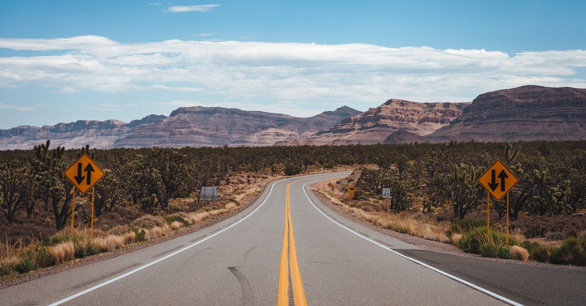 How do you view enemy unit attack ranges? - Empty asphalt road going through cactus fields towards rocky mountains against cloudy blue sky in United States of America How do you view enemy unit attack ranges? - Empty asphalt road going through cactus fields towards rocky mountains against cloudy blue sky in United States of America