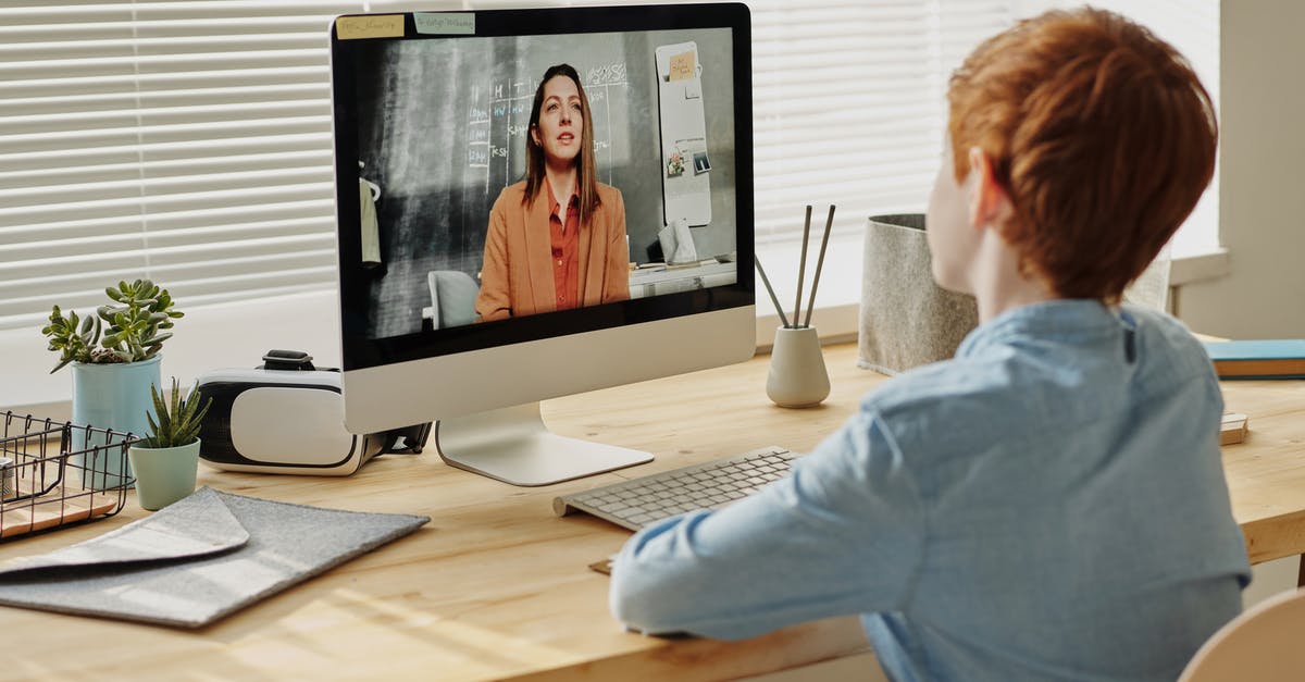 How do you zoom out when watching a replay? - Photo of Child Sitting by the Table While Looking at the Imac