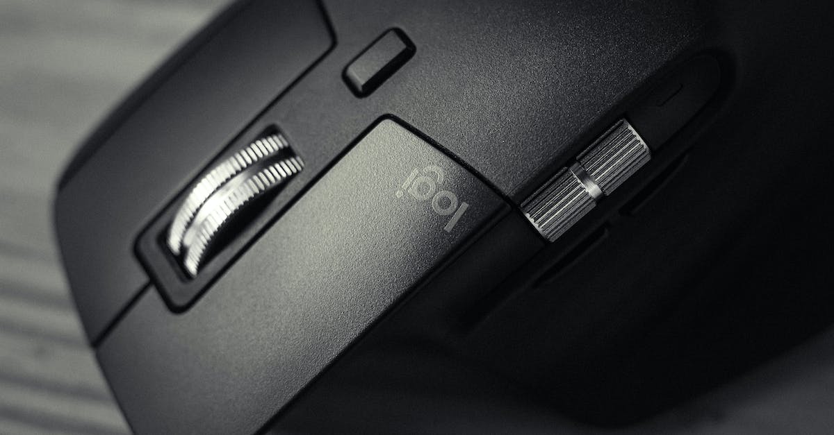 How does a New Game + differ from a standard New Game? - From above of wireless modern computer game new professional mouse on timber table