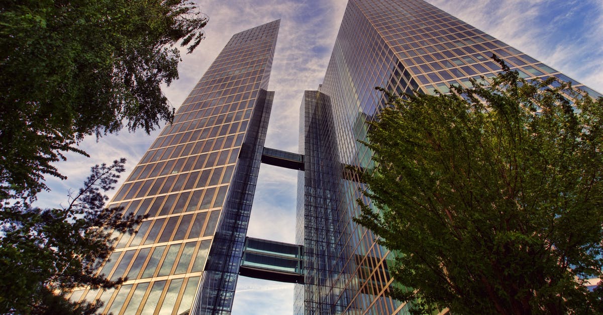 How does Amiibo Level Up work? [duplicate] - Low Angle Photo of Two Clear Glass Skyscrapers Under Clear Blue Sky