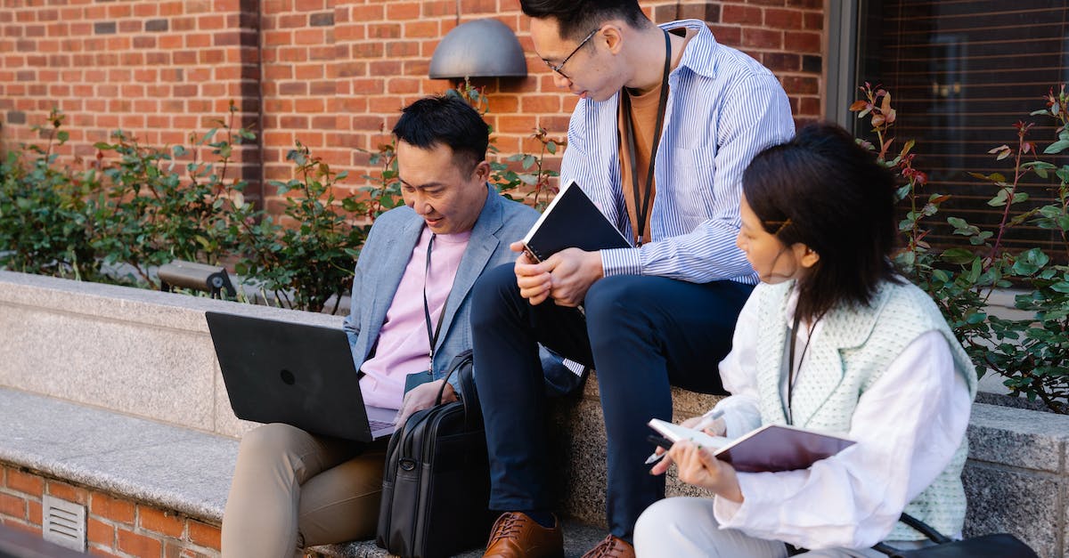 How does boosted exp. work? - Men and Woman Working Together Outside Building How does boosted exp. work? - Men and Woman Working Together Outside Building