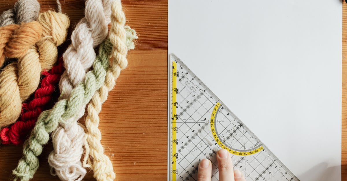 How does class progression for unlockable passives and skills/combat arts work in Fire Emblem 3 houses? - Top view of unrecognizable female weaver preparing template for future carpet on piece of paper using triangular protractor sitting at wooden table with yarn twists