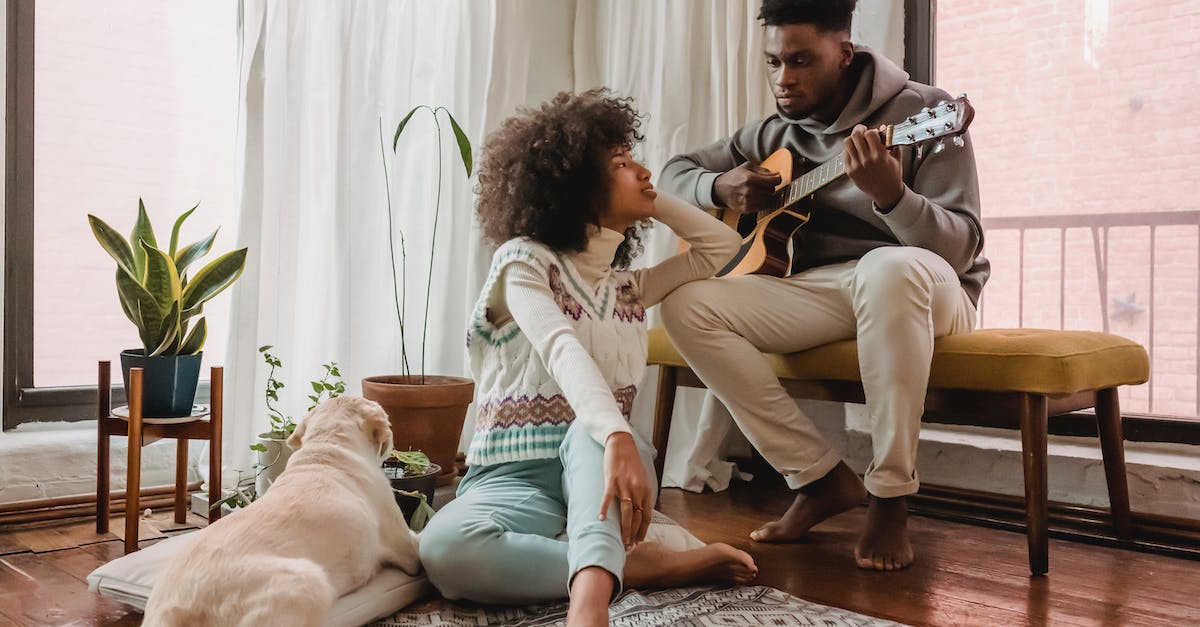 How does Epiphany affect skills? - Full body of black boyfriend playing acoustic guitar for African American girlfriend while spending time together in room with dog How does Epiphany affect skills? - Full body of black boyfriend playing acoustic guitar for African American girlfriend while spending time together in room with dog
