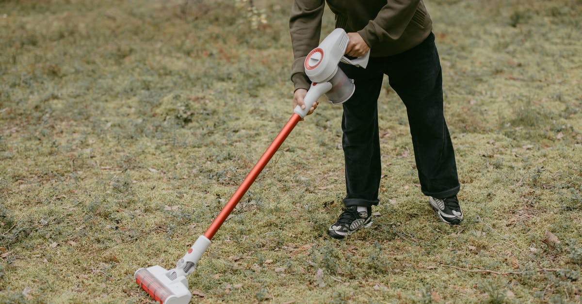 How does Freddy work? - Man in Brown Jacket and Black Pants Holding Red and White Stick