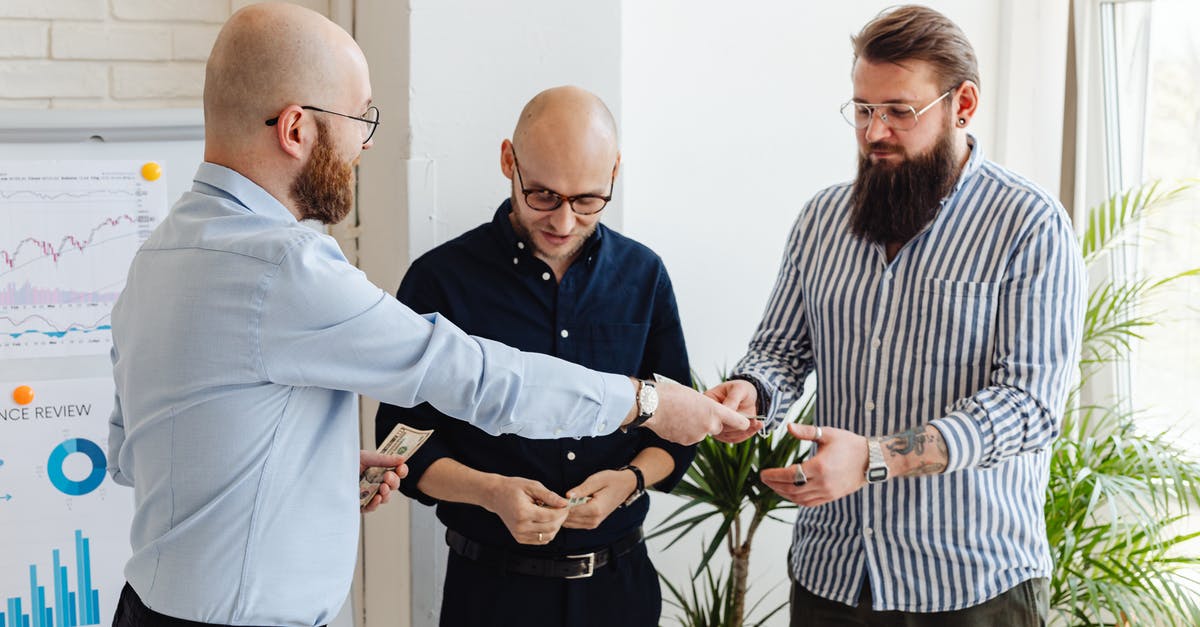 How does Freddy work? - Man in Blue Dress Shirt Standing Beside Man in White and Black Striped Dress Shirt