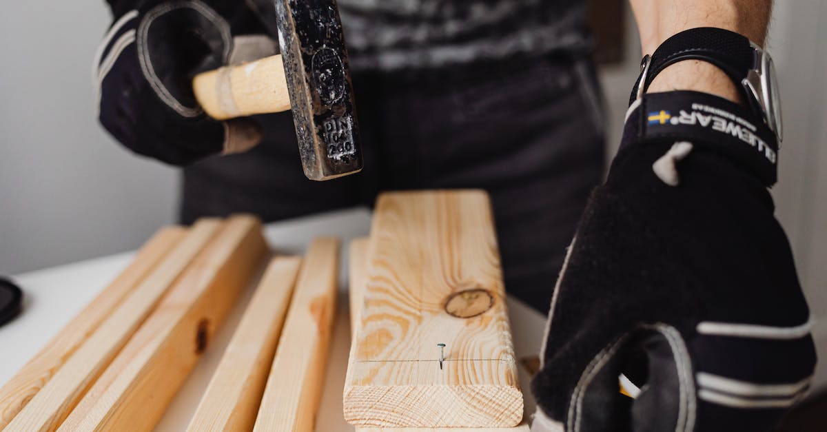 How does Game and Watch's hammer work? - Person Hammering a Nail into the Wood