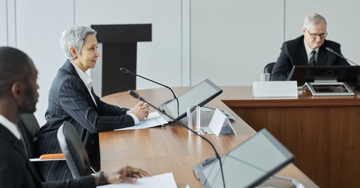 How does League Replays work? - Business People Sitting beside Conference Table