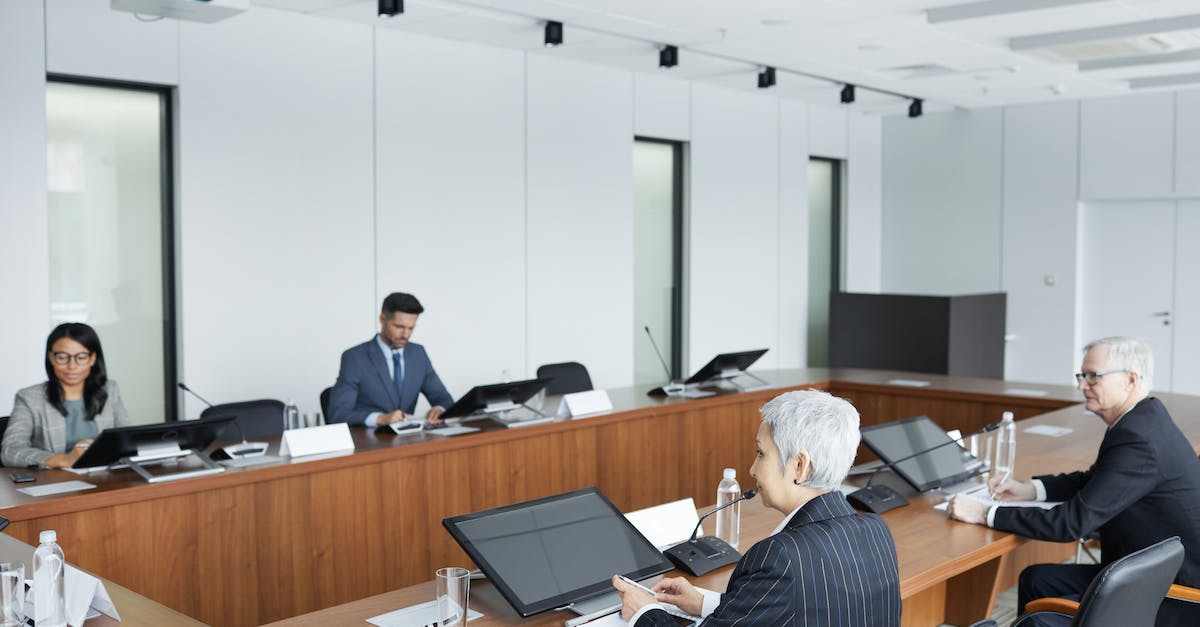 How does League Replays work? - People Sitting at Conference Table