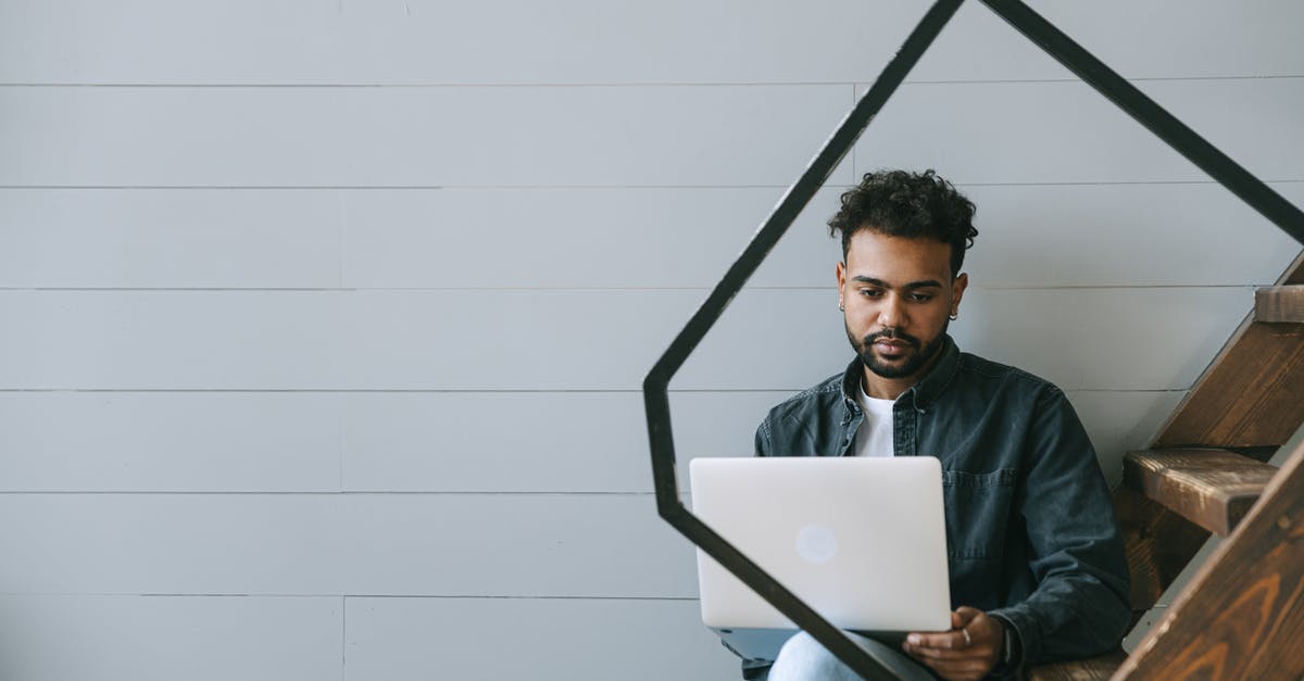 How does one gain access to Colossus Boulevard? - Man in Black Jacket Sitting on Chair Using Silver Macbook How does one gain access to Colossus Boulevard? - Man in Black Jacket Sitting on Chair Using Silver Macbook