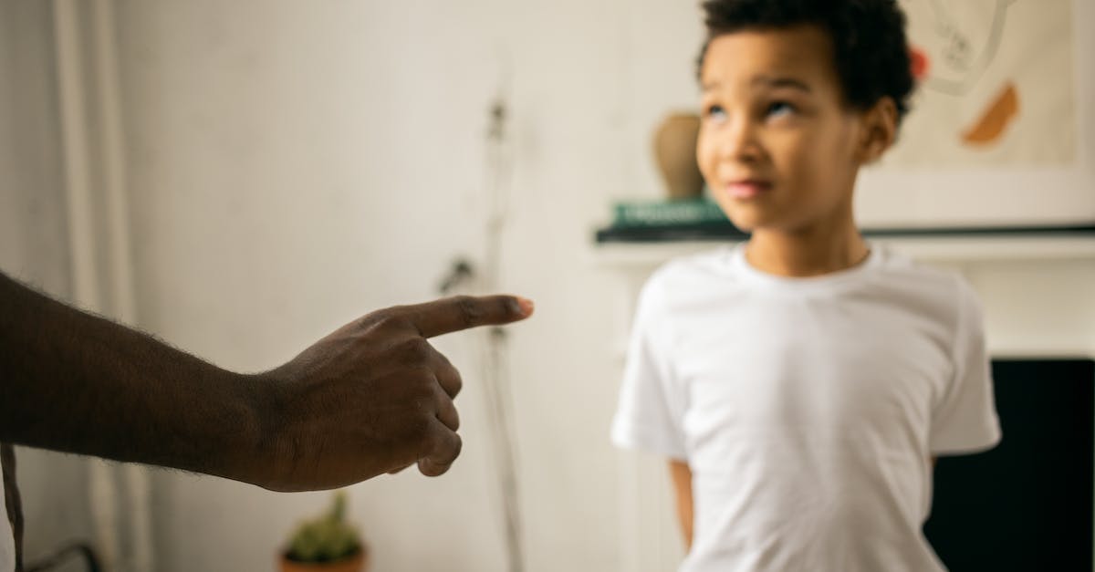 How does one get points in Angry Birds GO? - Upset little ethic boy looking at faceless father during argument