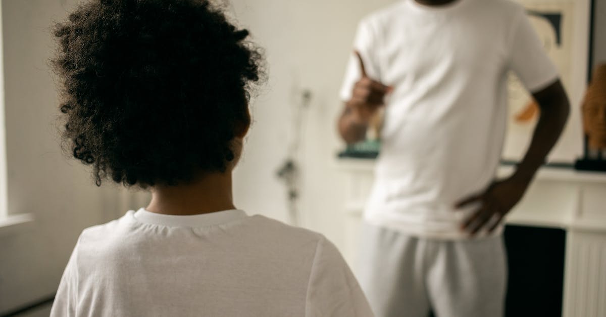 How does one get points in Angry Birds GO? - Back view of unrecognizable black boy with Afro hair standing in front of crop anonymous dad pointing finger and scolding at home How does one get points in Angry Birds GO? - Back view of unrecognizable black boy with Afro hair standing in front of crop anonymous dad pointing finger and scolding at home