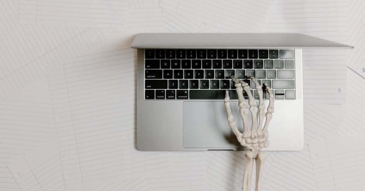 How does one spawn a wither skeleton with a name using a command? [duplicate] - Overhead Shot of a Skeleton Hand Typing on a Laptop
