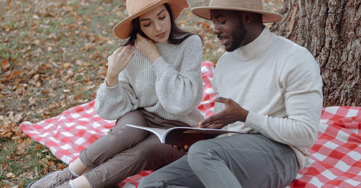 How does one tell what gender a Fallen is? - Woman in White Sweater Sitting Beside Woman in White Sweater